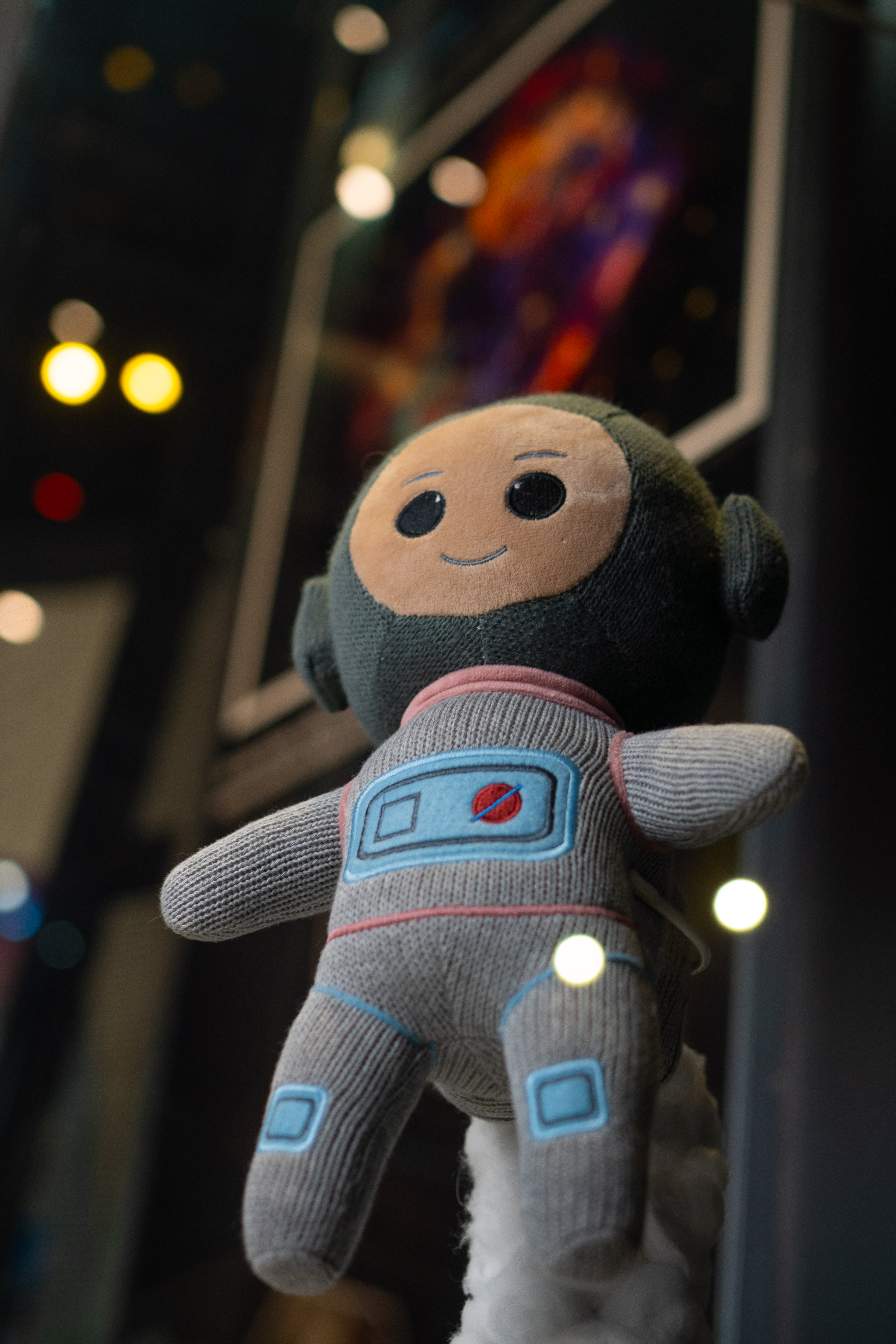 Ziggy toy in the galleries with Earth in the background