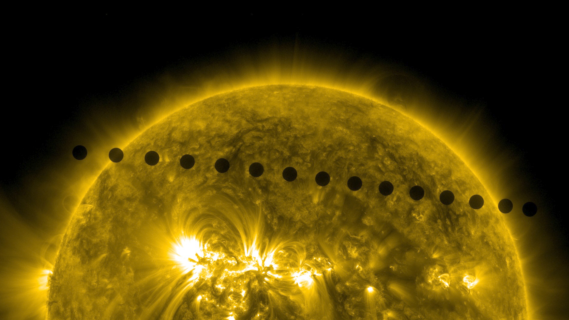A sequence of images composited together to show path of Venus across the Sun.