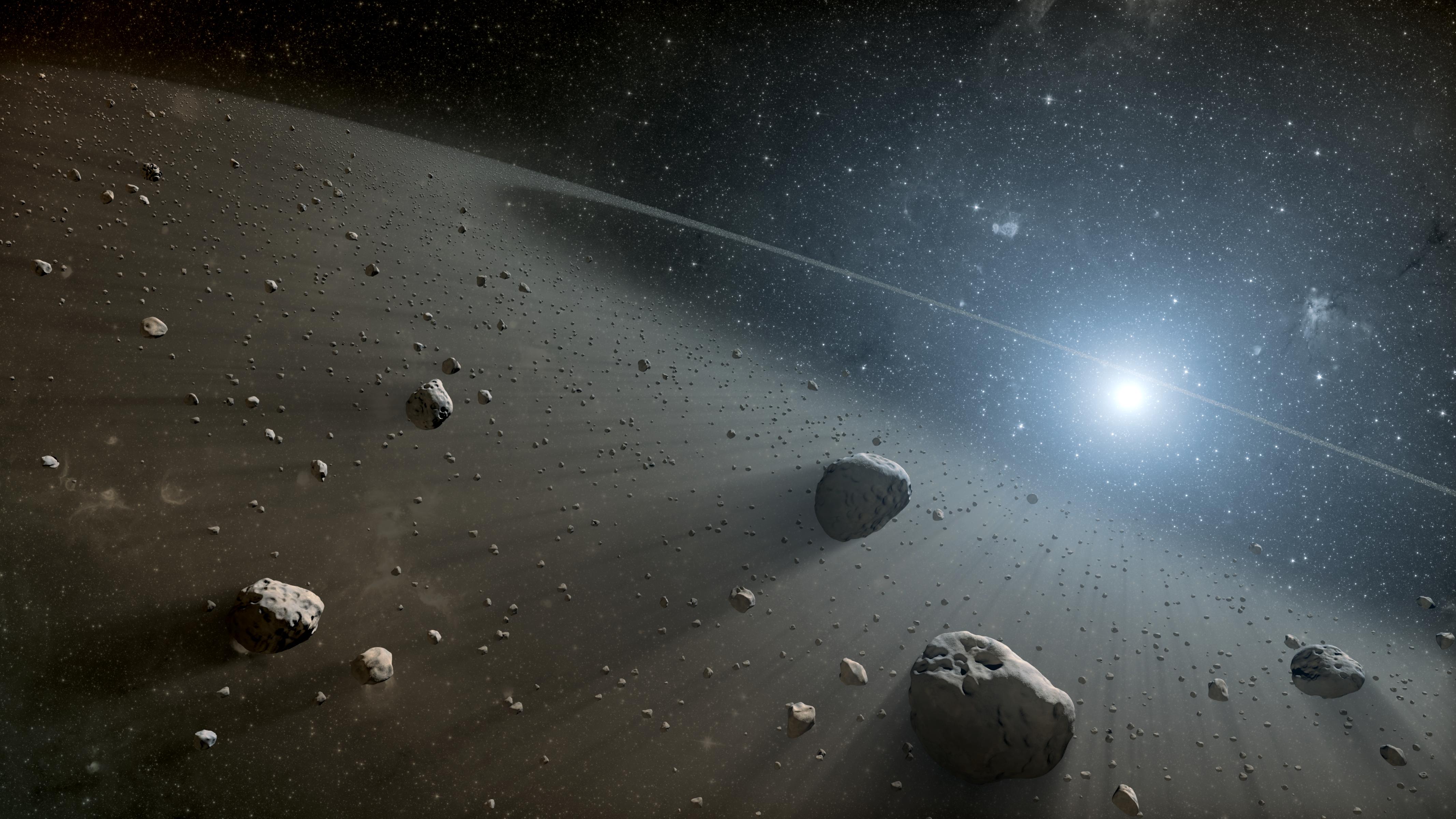 This artist's concept illustrates an asteroid belt around the bright star Vega