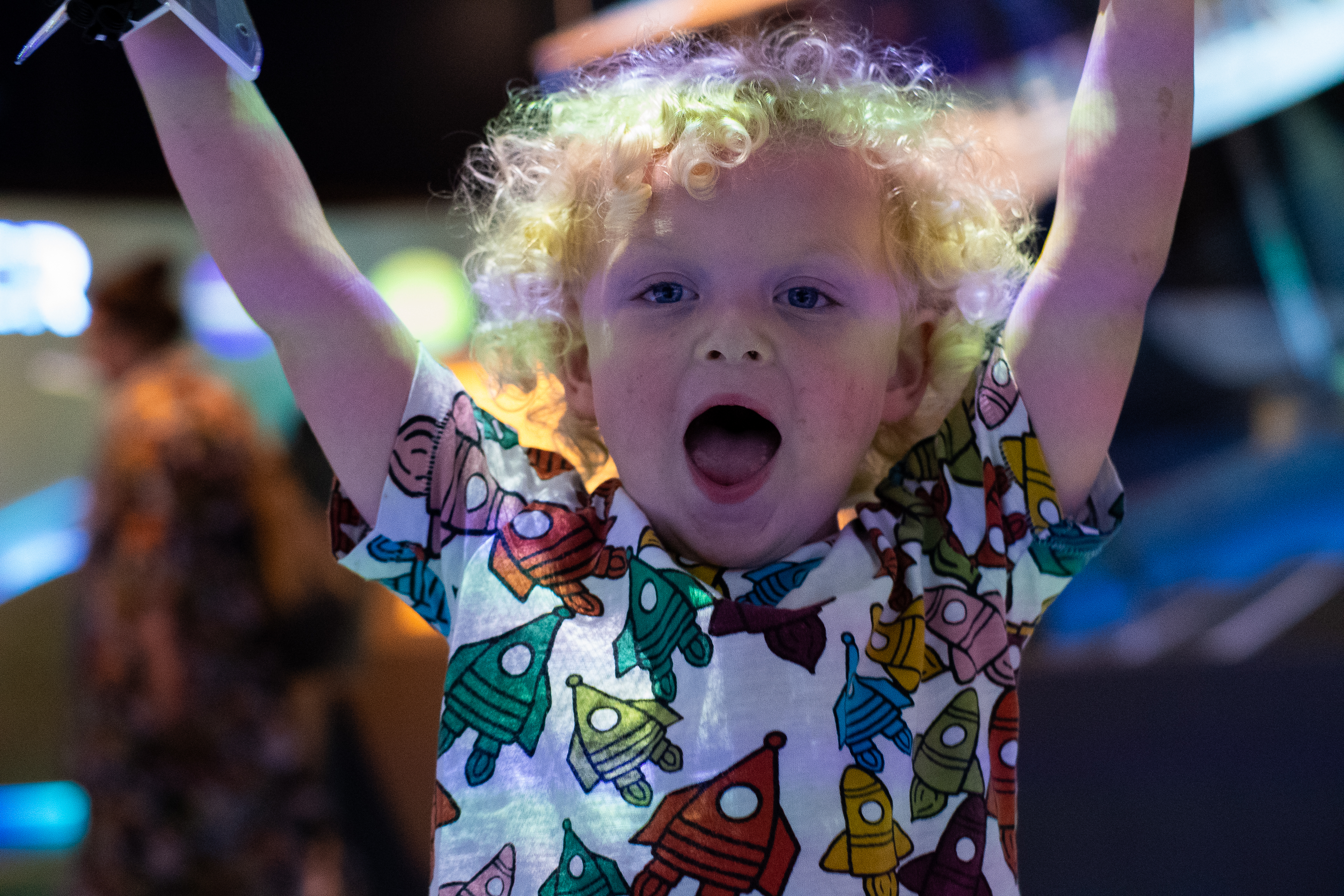 Very happy child with a space shuttle toy at Small Space day