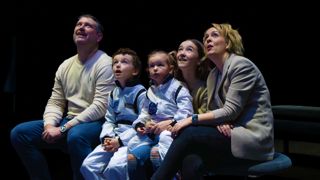 Family with two small children in the LIVE Space talks area