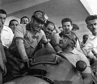 Juan Manuel Fangio (left) famously wore his work jacket, polo shirt and slacks. Argentina Grand Prix 1953. 