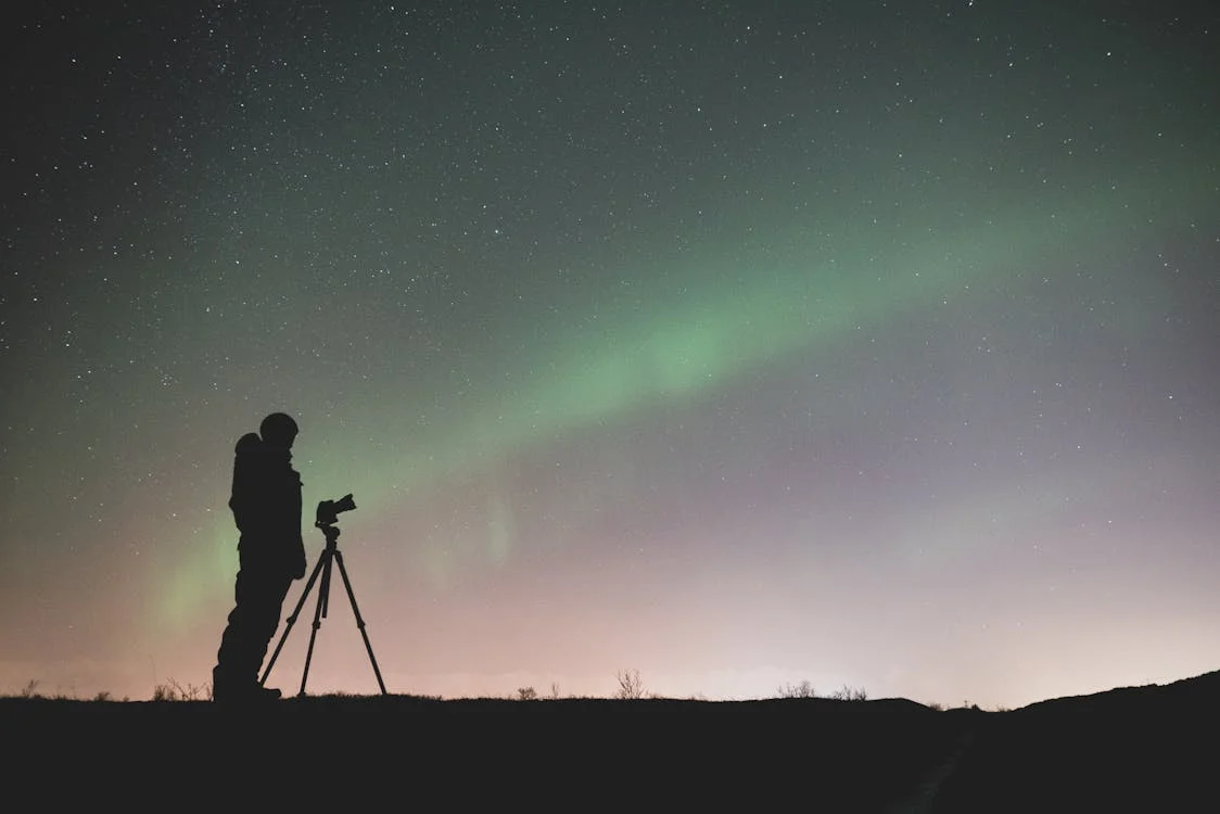 Photographing aurorae.