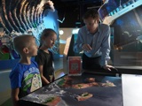 Children engaging with a talk at a Space LATES event