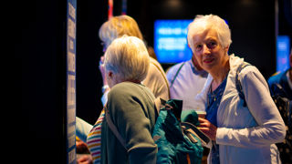 Group of older visitors at Boosters cafe servery