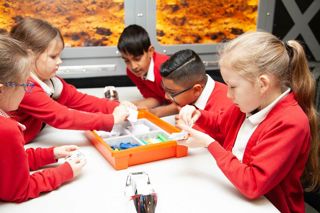 Primary School children participating in a craft activity.
