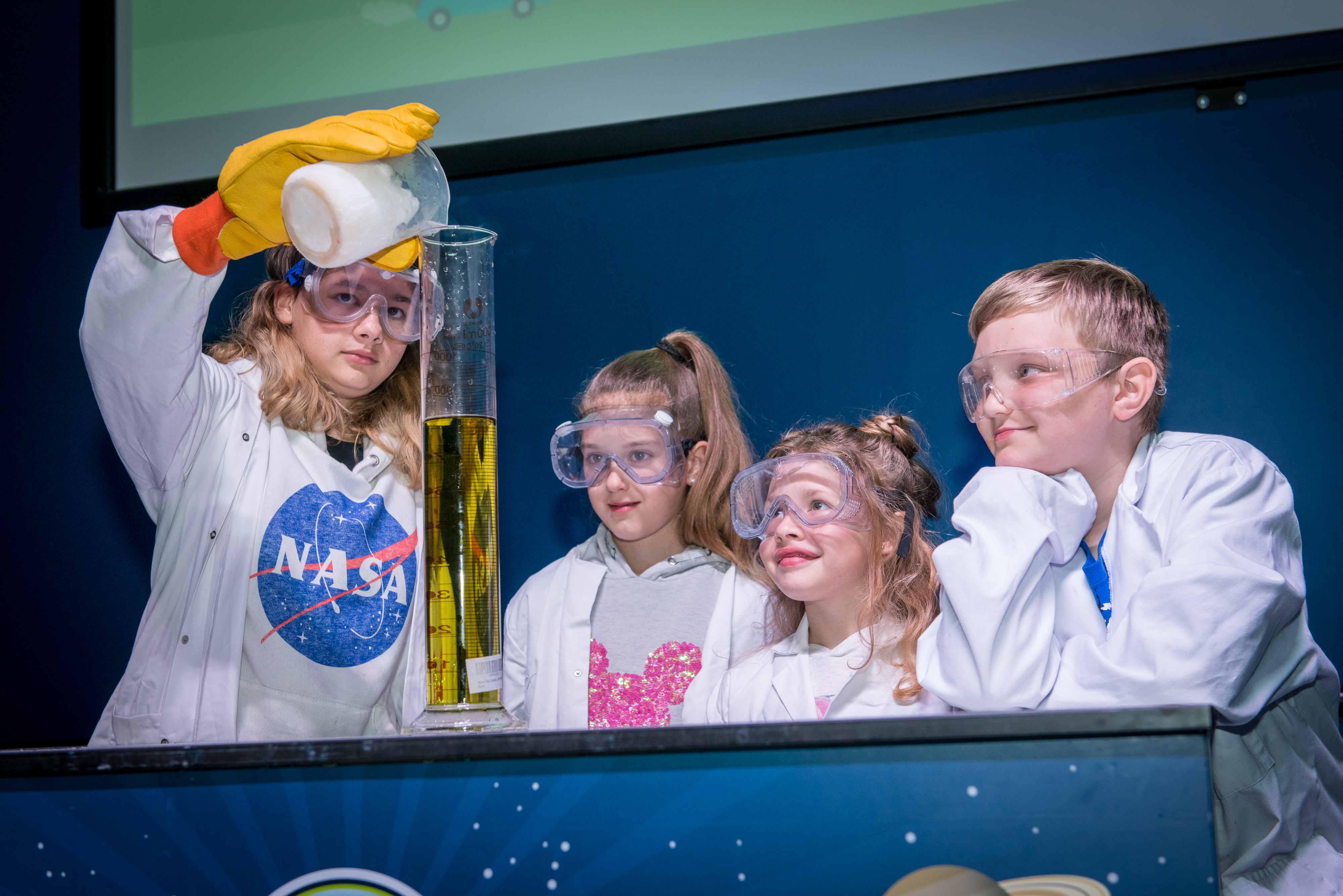 Children performing an experiment in LIVE Space