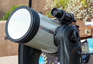 A telescope with a solar filter fitted to view a solar eclipse.