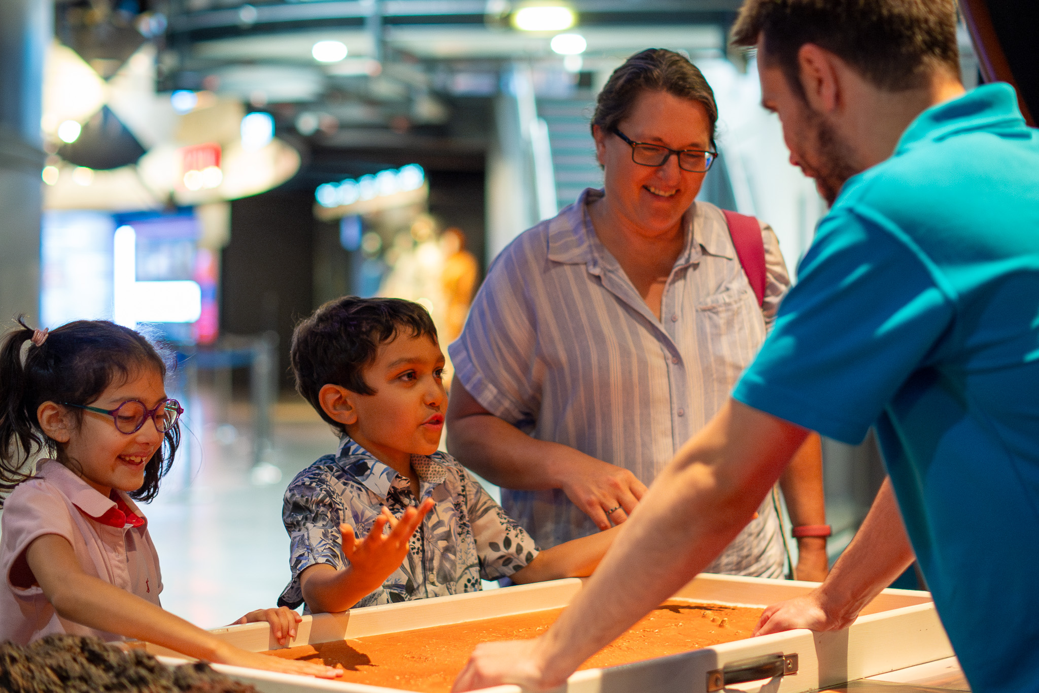 Family enjoying a science busk demonstration 
