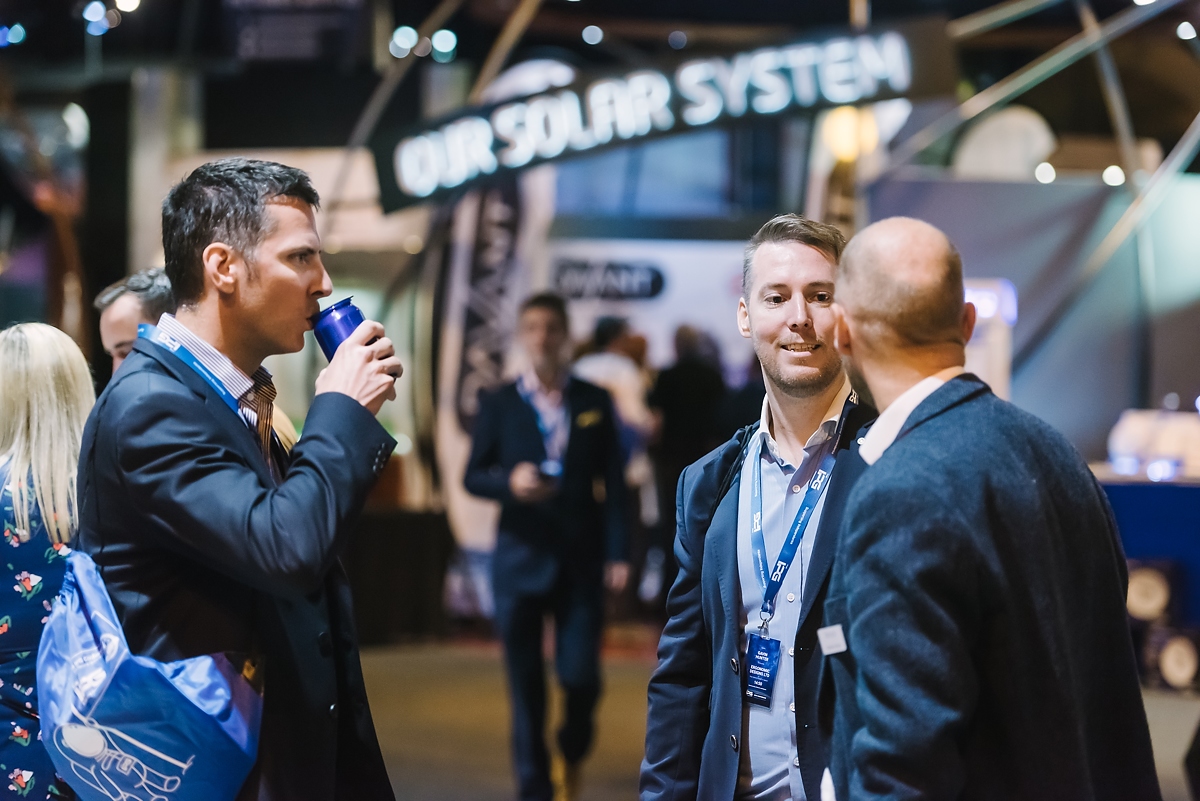 Group of business men in the main galleries at a conference
